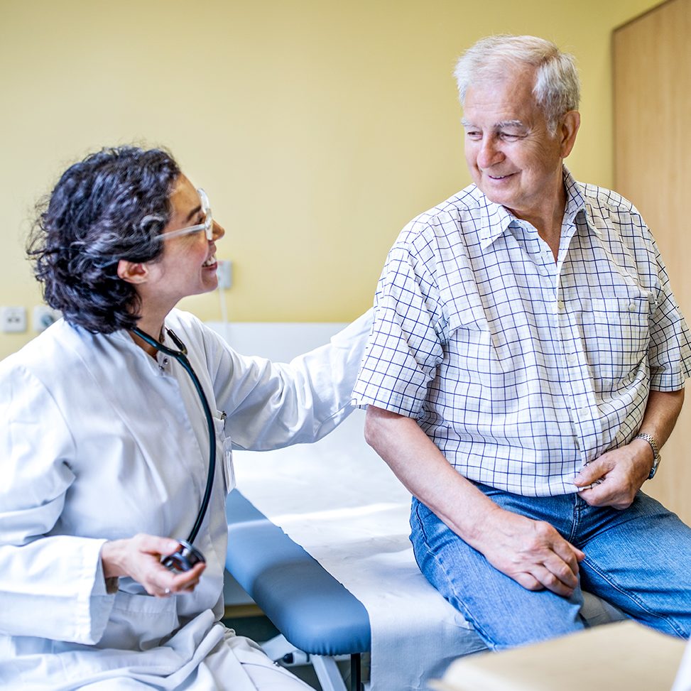 Email medical staff tending to a senior male patient