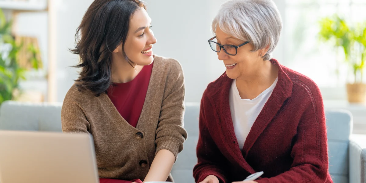 Family member helping senior with finances Family member helping senior with finances