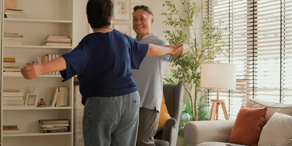 Senior couple dancing in apartment Senior couple dancing in apartment