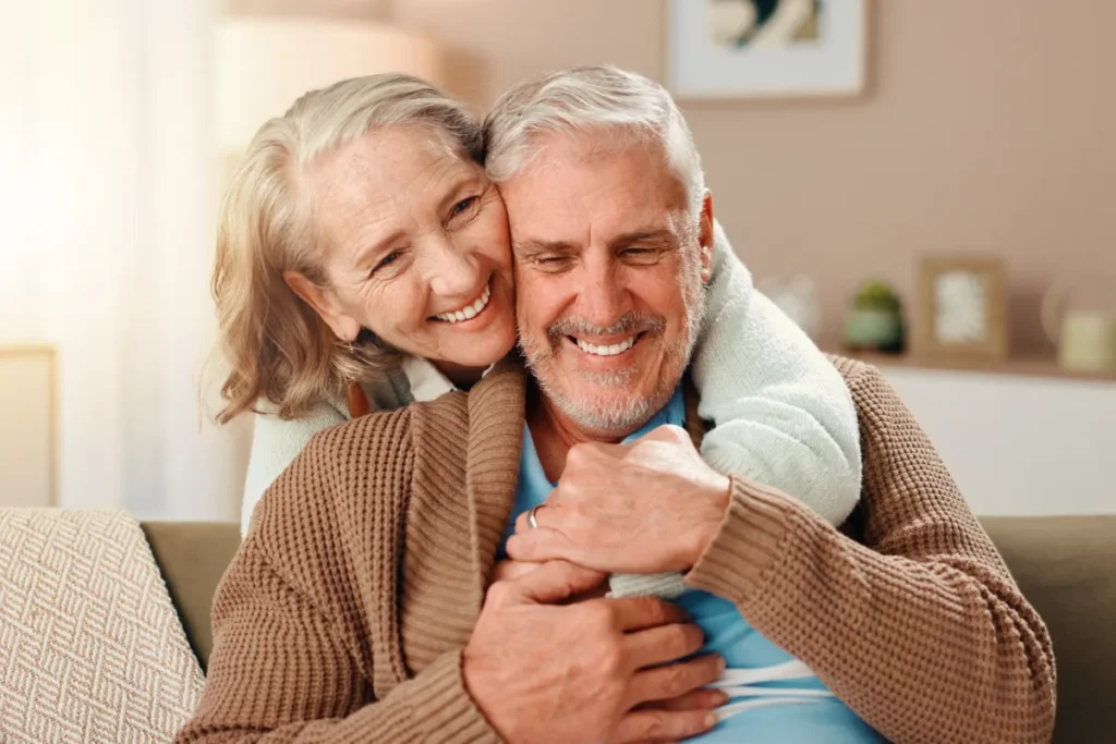 Senior couple embracing in apartment