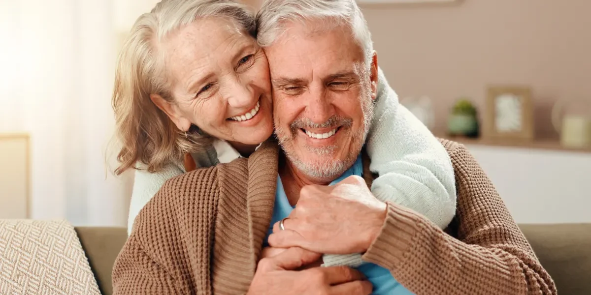 Senior couple embracing in apartment