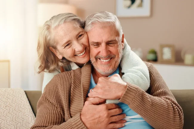 Senior couple embracing in apartment