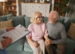 Senior couple talking with team member